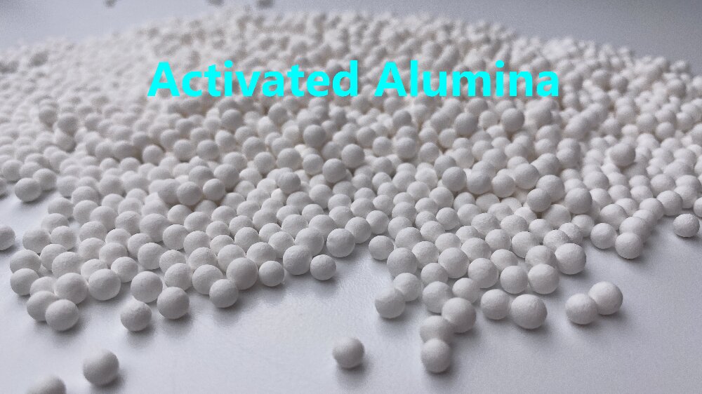 What else can activated alumina absorb besides water?