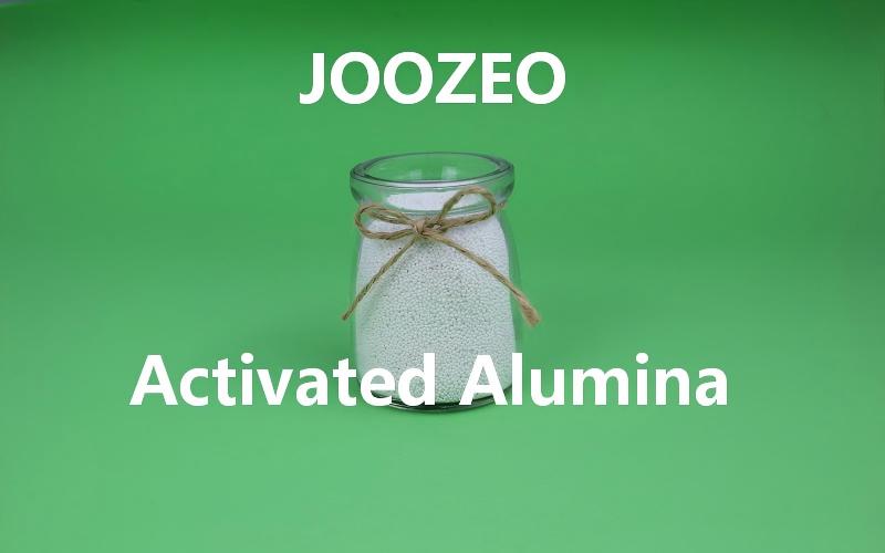 How does the specific surface area of activated alumina determine its adsorption performance?